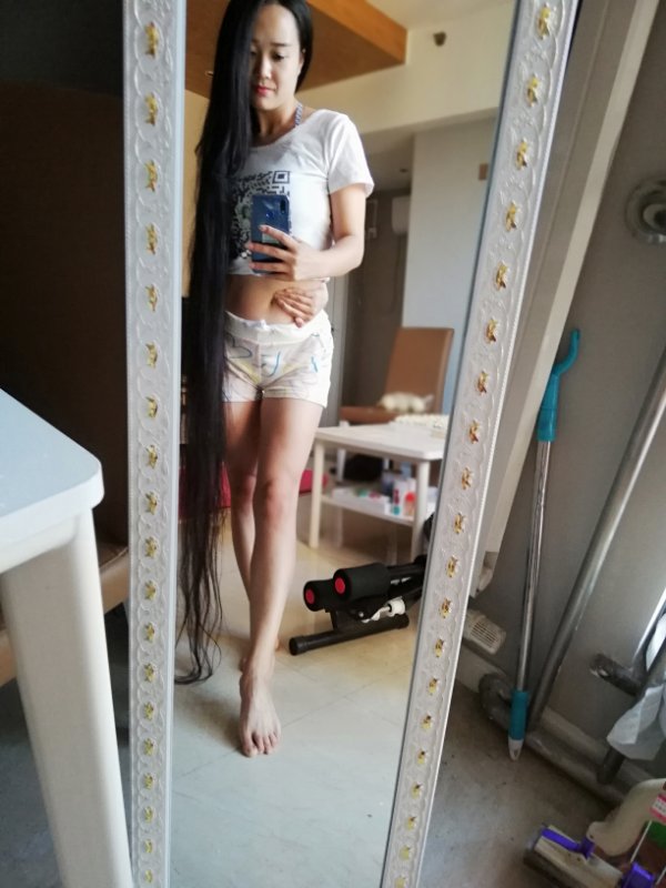 She has very long hair and thin waist